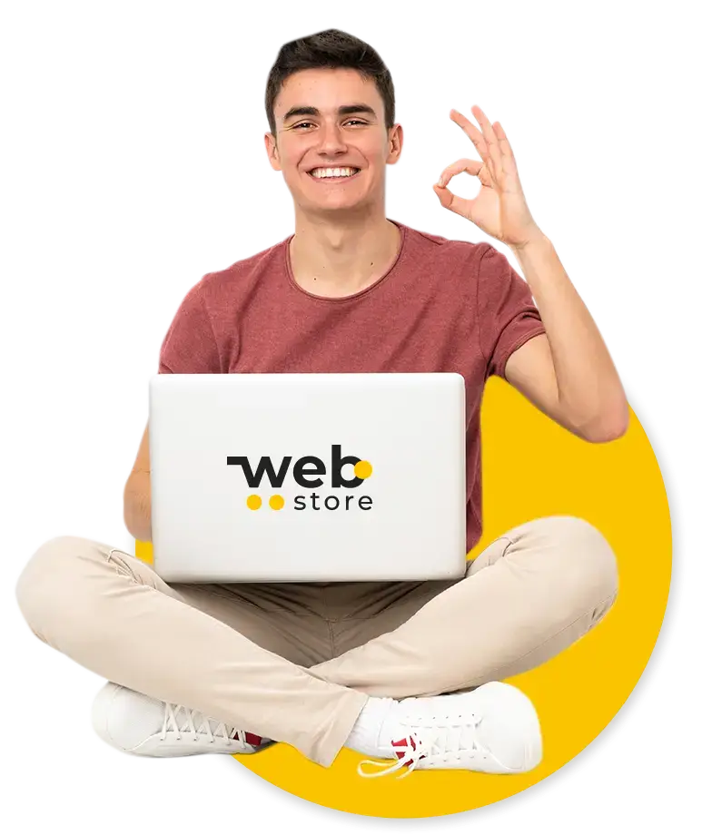 Hombre sentado con laptop de webstore en la mano la mano